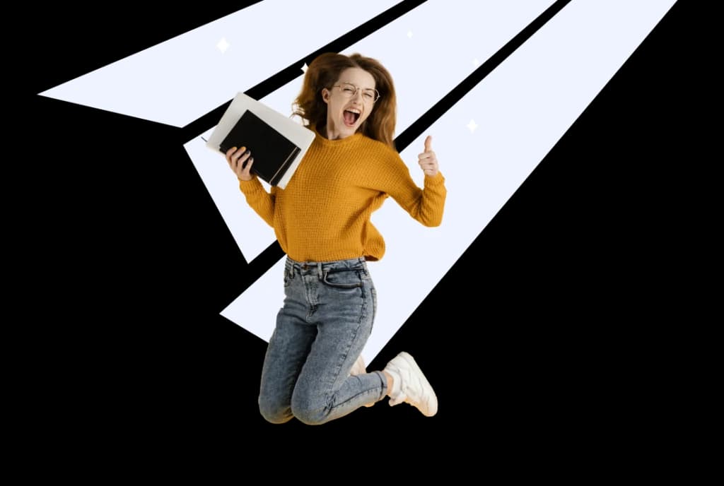 A woman jumping with a laptop against a geometric backdrop