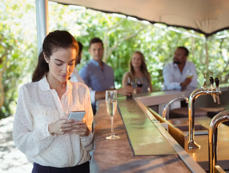Teardrop Hotels guest using a mobile phone