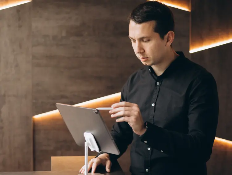 Teardrop Hotels staff member working with a tablet